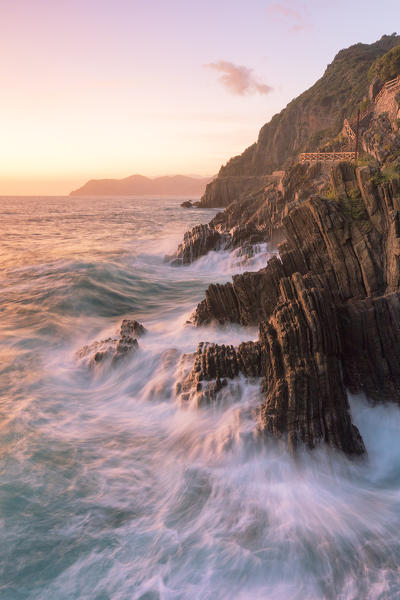 a coloured sunset on cliffs of Riomaggiore, National Park of Cinque Terre, Manarola, municipality of Riomaggiore, La Spezia Province, Liguria district, Italy, Europe