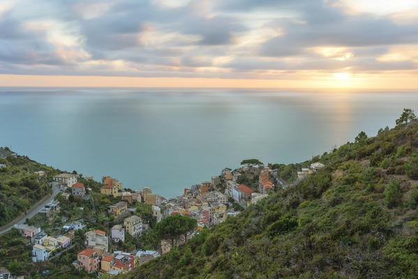 a panoramic view of little town of Riomaggiore at sunset, National Park of Cinque Terre, Manarola, municipality of Riomaggiore, La Spezia Province, Liguria district, Italy, Europe