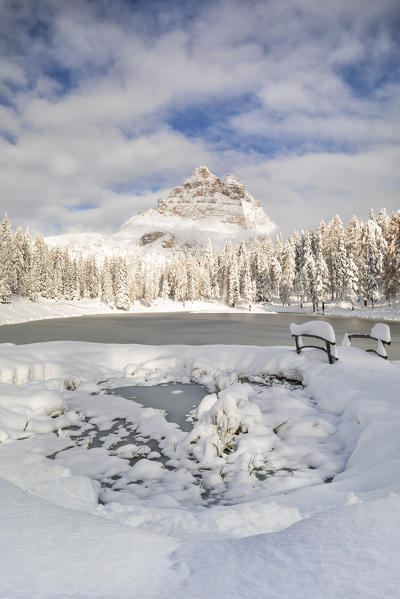 a famous Tre Cime of Lavaredo seen from the Antorno lake in winter time, Dolomiti, municipality of Auronzo di Cadore, Belluno province, Veneto district, Italy, Europe.