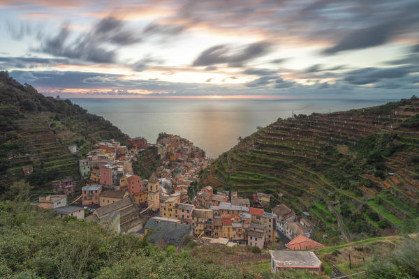 a long exposure to capture a magical sunset in Manarola, UNESCO World Heritage Site, National Park of Cinque Terre, municipality of Riomaggiore, La Spezia province, Liguria district, Italy, Europe