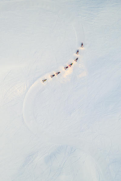 a column of snowmobile tourists advances in the snow, Madesimo ski area, Valtellina, municipality of Madesimo, Sondrio province, Lombardia district, Italy, Europe