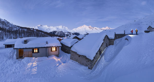 two photographers capture the sunrise in the historic village of Groppera, Valtellina, municipality of Madesimo, Sondrio province, Lombardia district, Italy, Europe