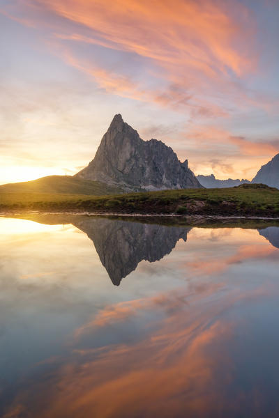 the Ra Gusela mountain reflected in small puddle of water at sunset, Giau Pass, Dolomiti, municipality of Cortina d'Ampezzo, Veneto district, Italy, Europe