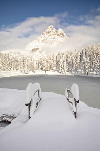 a famous Tre Cime of Lavaredo seen from the Antorno lake in winter time, Dolomiti, municipality of Auronzo di Cadore, Belluno province, Veneto district, Italy, Europe.