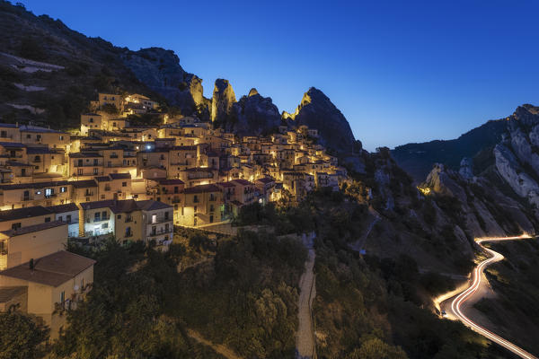 night view of the village of Castelmezzano during a blue hours in summer time, with the Lucanian Dolomites in the background, municipality of Castelmezzano, Potenza province, Basilicata district, southern Italy, Europe