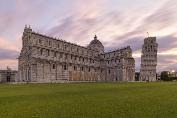 the extraordinary cathedral of Pisa with the adjacent leaning tower photographed on a coloured summer sunrise, Unesco World Heritage Site, municipality of Pisa, Pisa province, Tuscany district, Italy, Europe