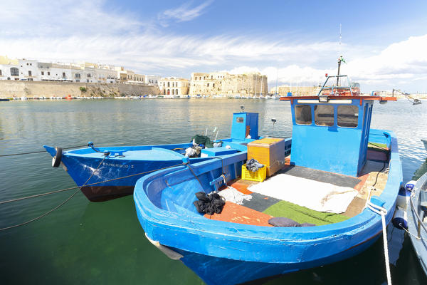 the fishing boats moored in the port of Gallipoli, during a summer day, located along the Ionic coast, municipality of Gallipoli, Lecce province, Apulia district, Italy, Europe