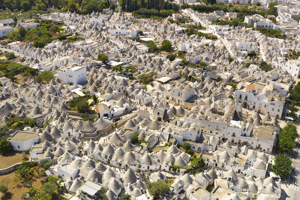 aerial view taken by drone of the typical village of Alberobello (Unesco World Heritage Site)(Unesco World Heritage Site) and its unique Trulli, during a splendid summer day, municipality of Alberobello, Bari province, Apulia district, Italy, Europe