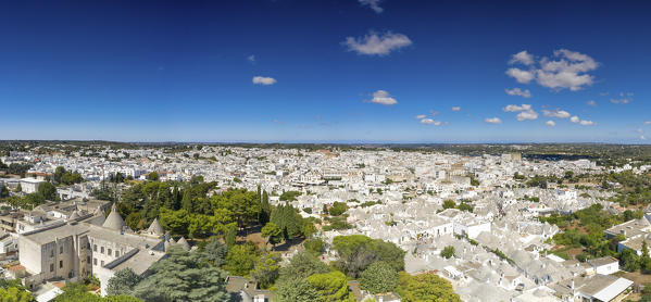 aerial view taken by drone of the typical village of Alberobello (Unesco World Heritage Site)(Unesco World Heritage Site) and its unique Trulli, during a splendid summer day, municipality of Alberobello, Bari province, Apulia district, Italy, Europe