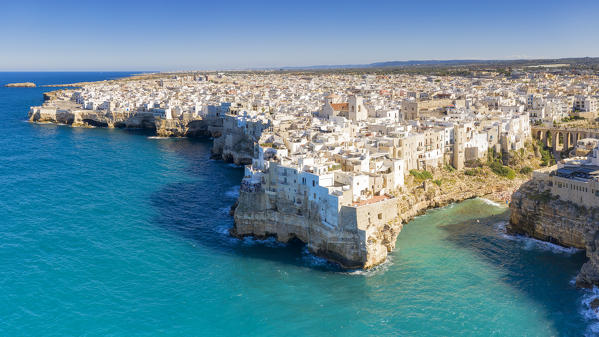 aerial view taken by drone of the splendid seaside village of Polignano a Mare, during a splendid summer day, municipality of Polignano a Mare, Bari province, Apulia district, Italy, Europe
