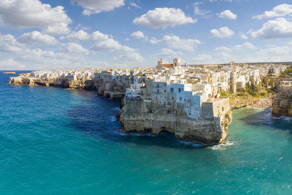 aerial view taken by drone of the splendid seaside village of Polignano a Mare, during a splendid summer day, municipality of Polignano a Mare, Bari province, Apulia district, Italy, Europe