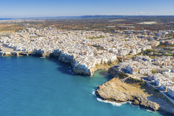 aerial view taken by drone of the splendid seaside village of Polignano a Mare, during a splendid summer day, municipality of Polignano a Mare, Bari province, Apulia district, Italy, Europe