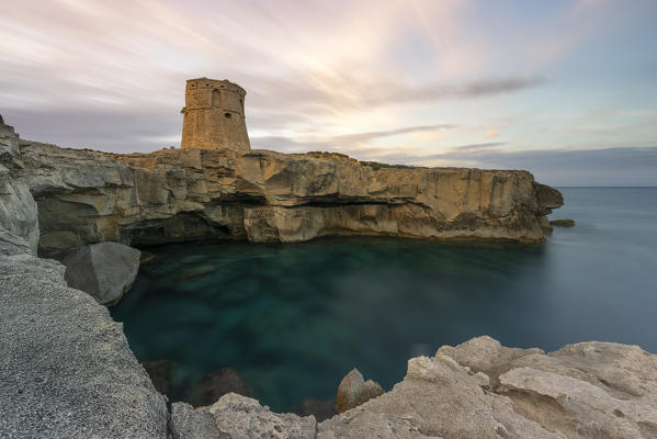 a long exposure to capture the summer sunset near the tower of Porto Miggiano, municipality of Santa Cesarea Terme, Lecce province, Apulia district, Italy, Europe