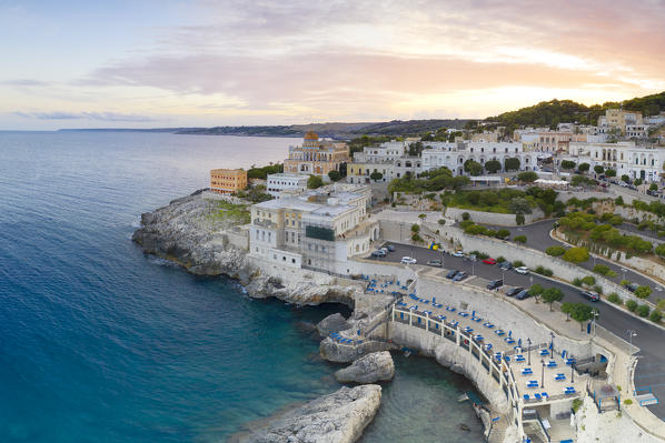 aerial view taken by drone of Santa Cesarea Terme at sunset in summer time, municipality of Santa Cesarea Terme, Lecce province, Apulia district, Italy, Europe