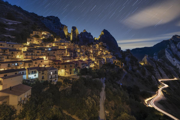 star trails over the village of Castelmezzano during a summer night, with the Lucanian Dolomites in the background, municipality of Castelmezzano, Potenza province, Basilicata district, southern Italy, Europe