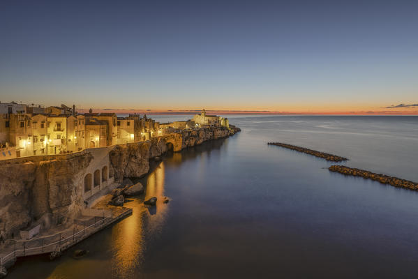 view of the historic center of Vieste, taken during a blue hour in summer time, municipality of Vieste, Foggia province, Apulia district, Italy, Europe