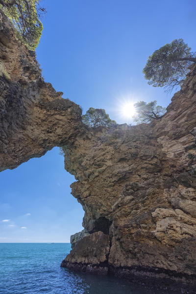 aerial view of the Gargano coast, characterized by white cliffs, caves and a crystalline sea, taken during a summer day, municipality of Vieste, Foggia province, Apulia district, Italy, Europe