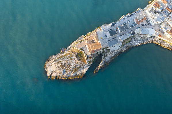 vertical aerial view of the historic center of Vieste, taken during a summer sunrise, municipality of Vieste, Foggia province, Apulia district, Italy, Europe