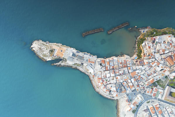 vertical aerial view of the historic center of Vieste, taken during a summer sunrise, municipality of Vieste, Foggia province, Apulia district, Italy, Europe