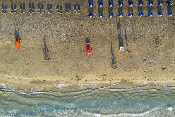 vertical aerial view of the equipped beach of Vieste, taken during a summer sunrise, municipality of Vieste, Foggia province, Apulia district, Italy, Europe
