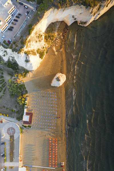vertical aerial view of the equipped beach of Vieste, taken during a summer sunrise, municipality of Vieste, Foggia province, Apulia district, Italy, Europe