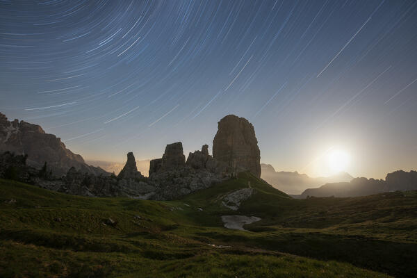 a startrails with lunar sunrise photographed during a summer night near the Cinque Torri, Dolomiti, Unesco World Heritage Site municipality of Cortina d'Ampezzo, Belluno province, Veneto district, Italy, Europe