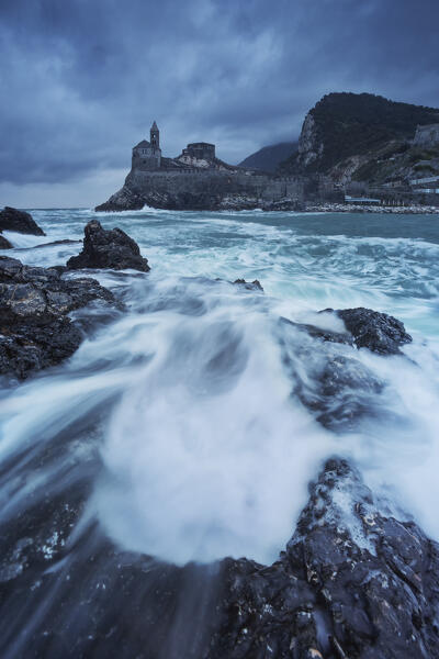a sea storm along cliffs of San Pietro Church durind a cloudy day, UNESCO World Heritage Site, municipality of Portovenere, La Spezia province, Liguria, Italy, Europe
