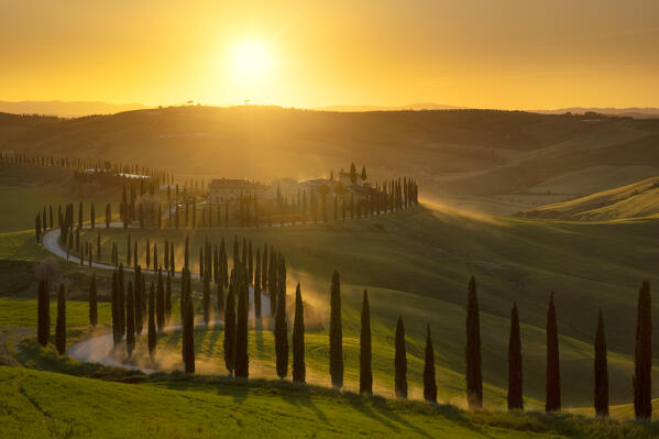 a warm light envelops the farmhouse Baccoleno at sunset, municipality of Asciano, Siena province, Tuscany district, Italy, Europe