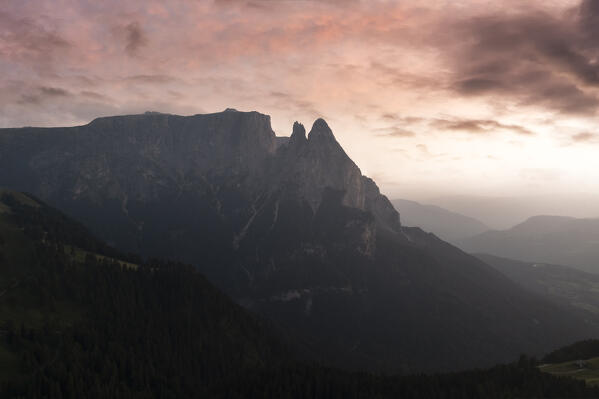 aerial view of Alpe di Siusi/Seiser Alm, Dolomites, South Tyrol, Italy. The sunset over the Alpe di Siusi with the peaks of Sciliar. Bolzano province, Trentino-Alto Adige district, Italy, Europe