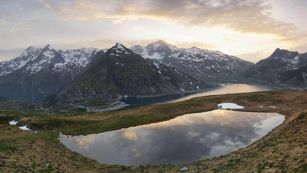 aerial view taken by drone of Andossi Lake, during a warm summer sunset, Spluga pass, Orobie mountain, Sondrio province, Lombardy district, Italy, Europe