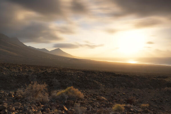 a long exposure to capture the sunset at Cofete Beach during a summer day, Natural Park de Jandia, Fuerteventura, Canary Island, Spain, Europe