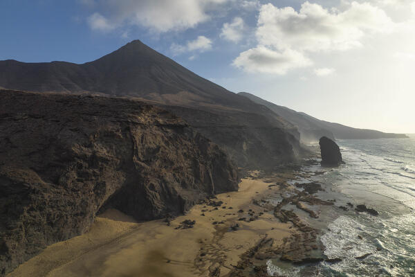 aerial view taken by drone of the cliffs near to Playa de Cofete during a summer day, Natural Park de Jandia, Fuerteventura, Canary Island, Spain, Europe