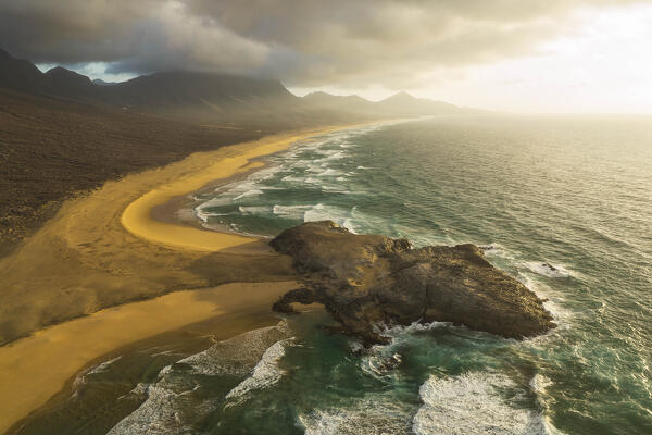 aerial view taken by drone of Cofete Beach during a summer warm sunset, Natural Park de Jandia, Fuerteventura, Canary Island, Spain, Europe