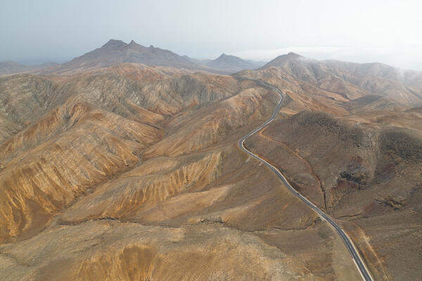 aerial view taken by drone of the asphalt road to Mirador astronomico de Sicasumbre during a summer day, Sicasumbre, Fuerteventura, Canary Island, Spain, Europe