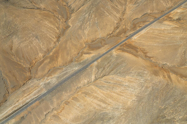 aerial view taken by drone of the asphalt road to Mirador astronomico de Sicasumbre during a summer day, Sicasumbre, Fuerteventura, Canary Island, Spain, Europe