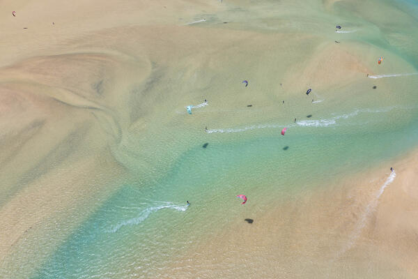 aerial view taken by drone of a beautiful beach of Sotavento during a summer sunny day, with many a kitesurfers, Fuerteventura, Canary Island, Spain Europe