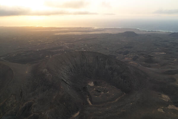 aerial view taken by drone of the volcanic area near to Corralejo during a summer sunset, Natural Park of Corralejo, Fuerteventura, Canary Island, Spain, Europe