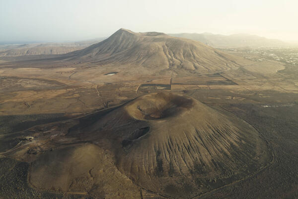 aerial view taken by drone of the Montaña Negra Volcano, Natural Park of Corralejo, shooted during a summer day, Fuerteventura, Canary Island, Spain, Europe