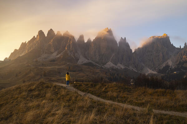 one girl enjoy the beautiful view at Gardena pass during an autumn sunset, Gardena Pass, Gardena valley, Bolzano province, Trentino Alto Adige, Dolomiti, Italy, Europe