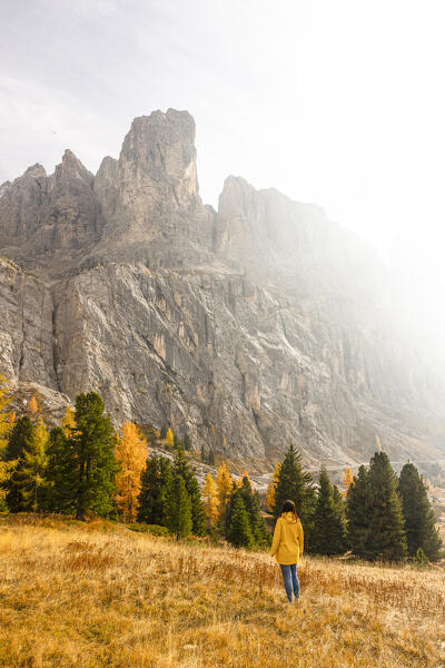one girl enjoy the beautiful view at Gardena pass during an autumn sunset, Gardena Pass, Gardena valley, Bolzano province, Trentino Alto Adige, Dolomiti, Italy, Europe