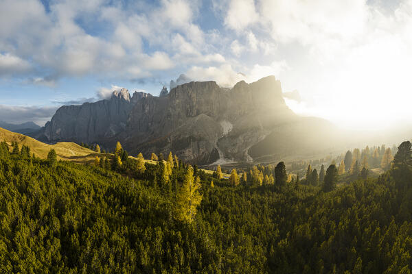 an amazing warm light envelope the landscape at Gardena pass, during an autumn sunset, Gardena valley, Bolzano province, Trentino Alto Adige, Dolomiti, Italy, Europe