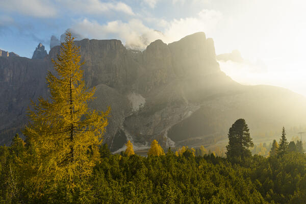 an amazing warm light envelope the landscape at Gardena pass, during an autumn sunset, Gardena valley, Bolzano province, Trentino Alto Adige, Dolomiti, Italy, Europe