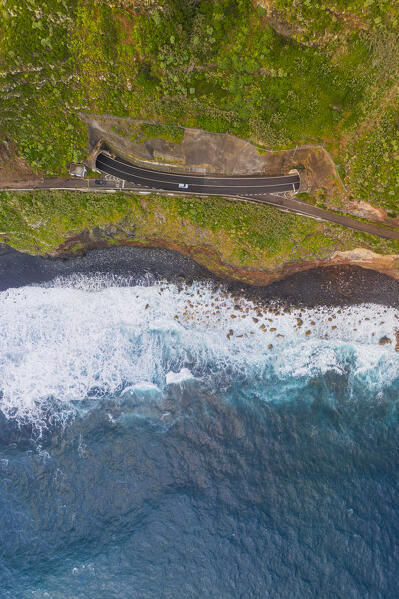 Aerial vertical view of the coastal road in Madeira Island during a sunny spring day, Porto Moniz, Madeira, Portugal, Europe