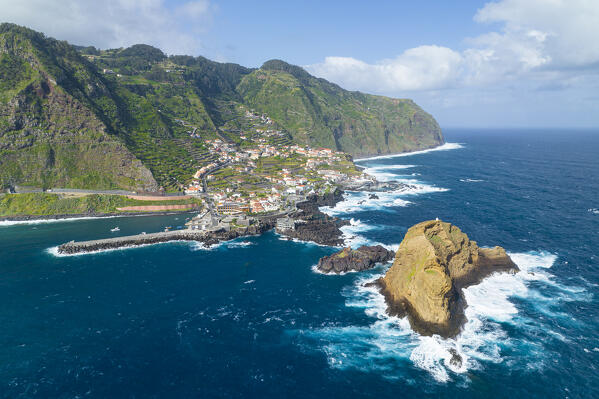Aerial view of the city center of Porto Maniz during a spring day of rough seas, Porto Moniz, Madeira, Portugal, Europe
