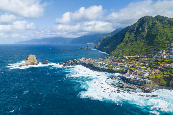 Aerial view of the city center of Porto Maniz during a spring day of rough seas, Porto Moniz, Madeira, Portugal, Europe