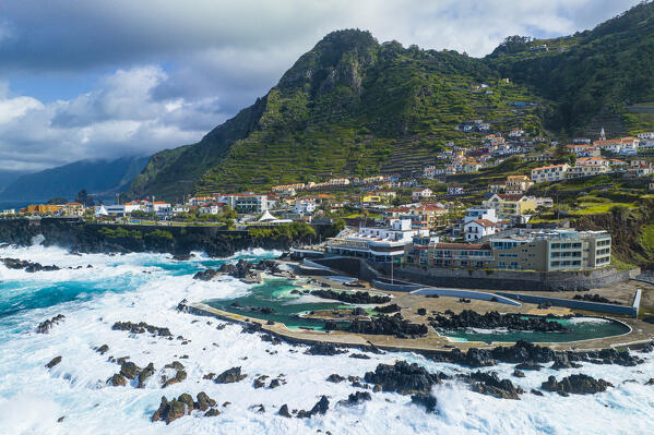 Aerial view of the city center of Porto Maniz during a spring day of rough seas, Porto Moniz, Madeira, Portugal, Europe