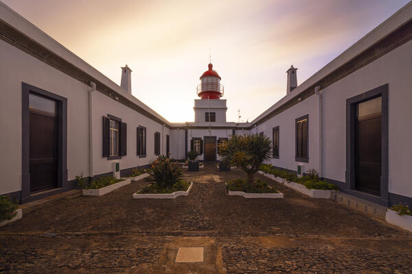a warm light envelope the beautiful Farol da Ponta do Pargo during a spring sunset, Madeira, Portugal, Europe