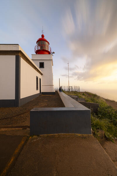 a warm light envelope the beautiful Farol da Ponta do Pargo during a spring sunset, Madeira, Portugal, Europe