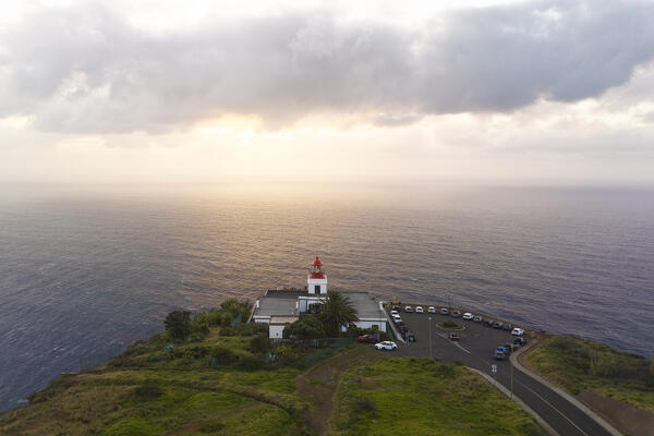 a warm light envelope the beautiful Farol da Ponta do Pargo during a spring sunset, Madeira, Portugal, Europe