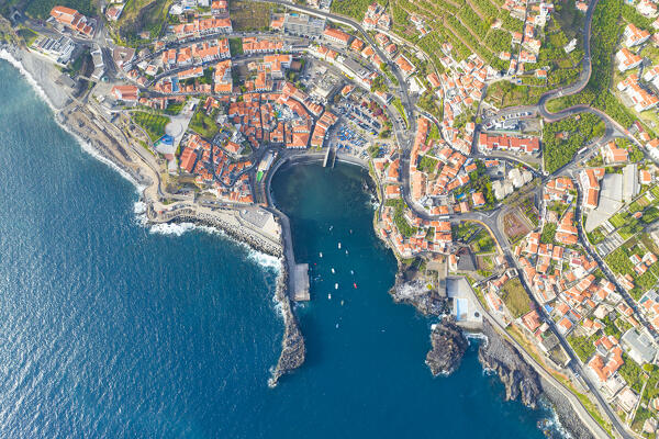 aerial view taken by drone of the little touristic village of Camara de Lobos during a sunny spring day, Madeira, Portugal, Europe